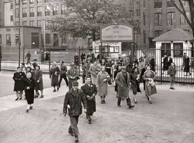 Mill workers leaving work